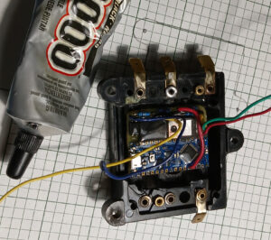 11. Version 2 PCB Being Glued to Case